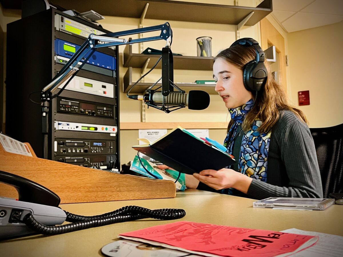 Picture of Eleanor Bolker speaking at a microphone