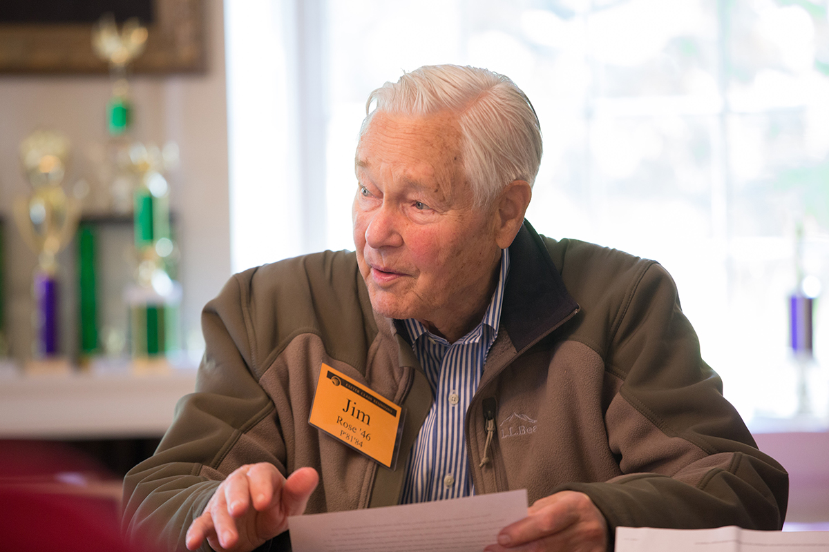 Jim Rose seated at a table during an Exeter reunion.