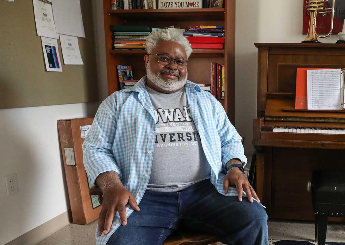 A smiling man sitting in a chair