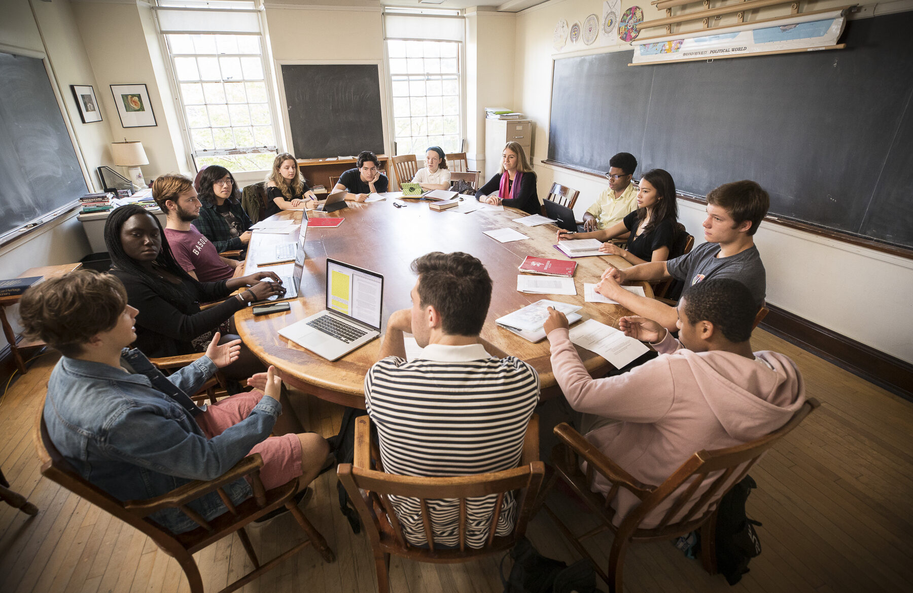 Students sit around a Harkness table