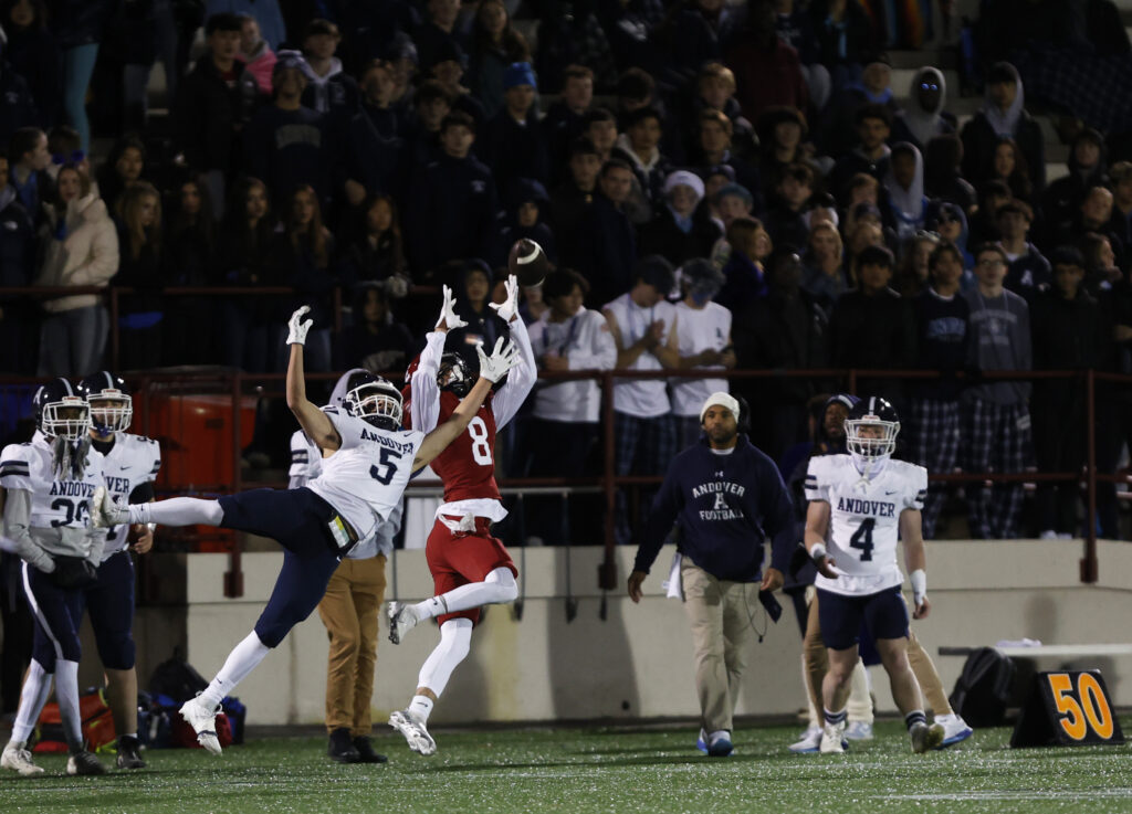 Football player making a catch at Phelps Stadium at Phillips Exeter Academy