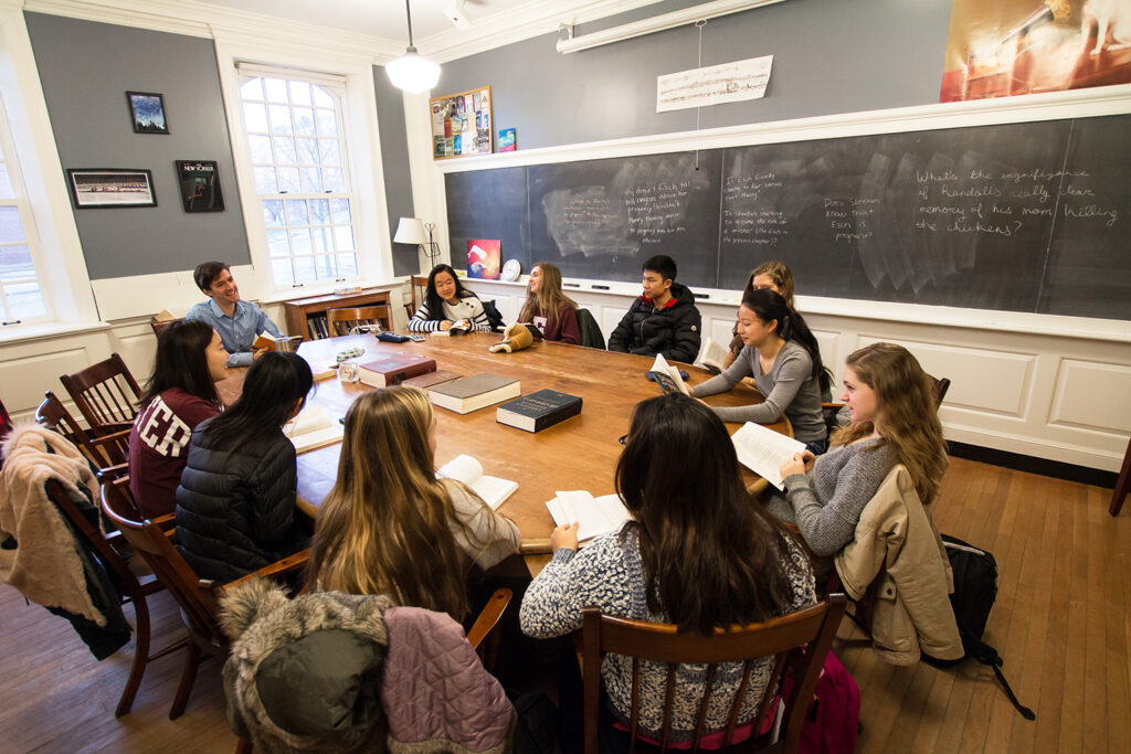 Students sit around Harkness table