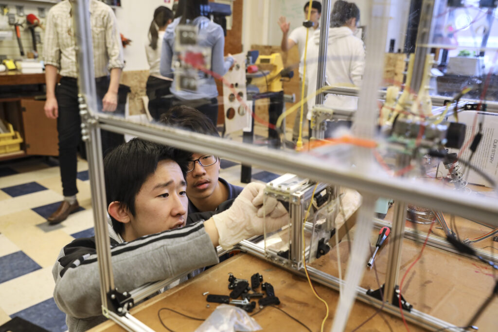 Students examine science project