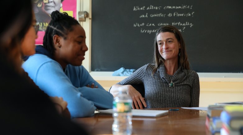 Sasha Kramer '94 sits at Harkness table with student