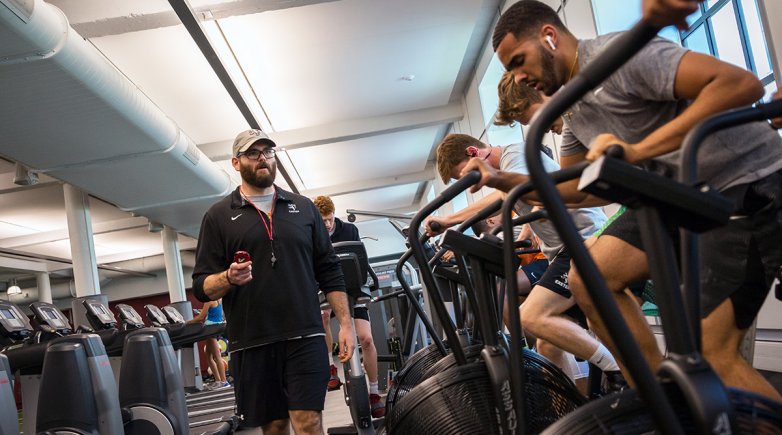 Shaun Fishel works with students in the Downer Fitness Center at Exeter.