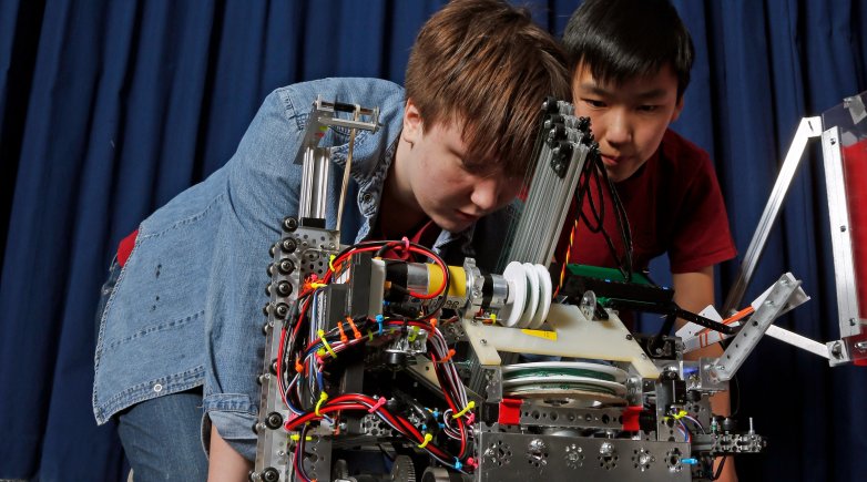 VERTEX team members work on the robot in the Design Lab.