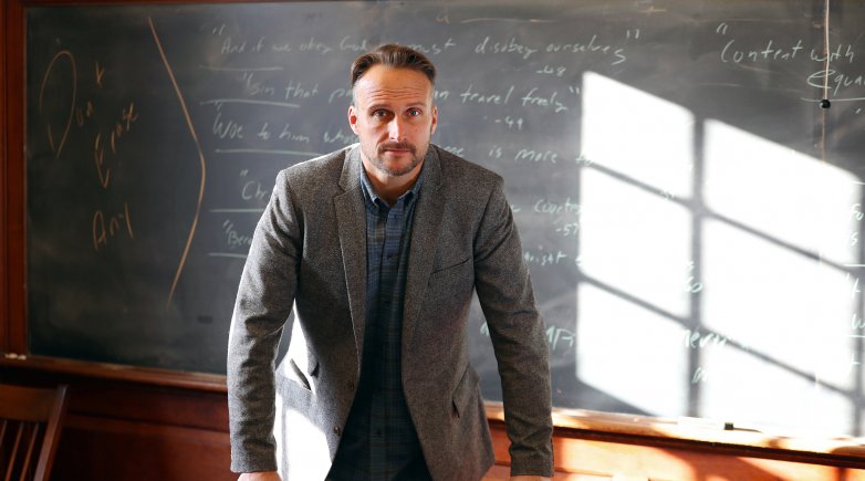 Matt in front of the chalkboard in his Phillips Hall classroom.