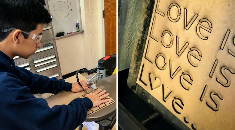 Boy using the laser cutter.