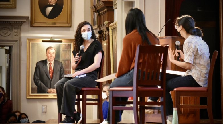 Devi Lockwood '10 (left) sits for an interview with Emma Chen '22 (center) and Lina Huang '22 during assembly Friday, Dec. 17, 2021.