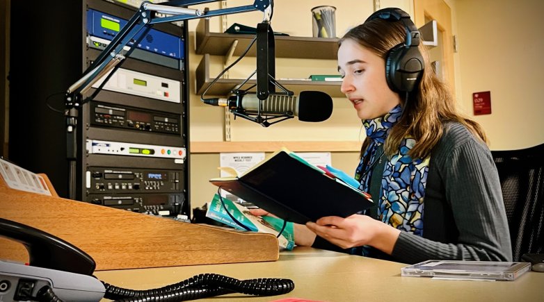 Picture of Eleanor Bolker speaking at a microphone