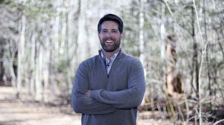 Exeter's Manager of Sustainability Warren Biggins at trailhead of Exeters trail network