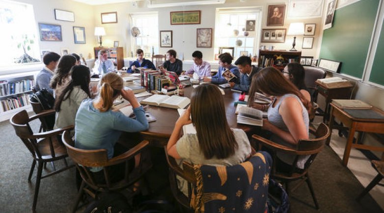 Students in English Instructor Todd Hearon’s class sitting around a Harkness table at Exeter