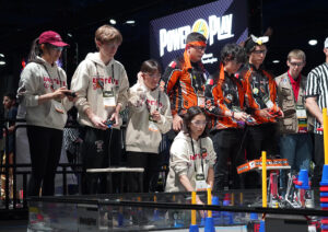 Team of students competing in a robotics competition