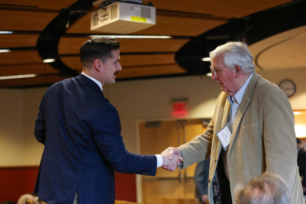 Two men shaking hands.