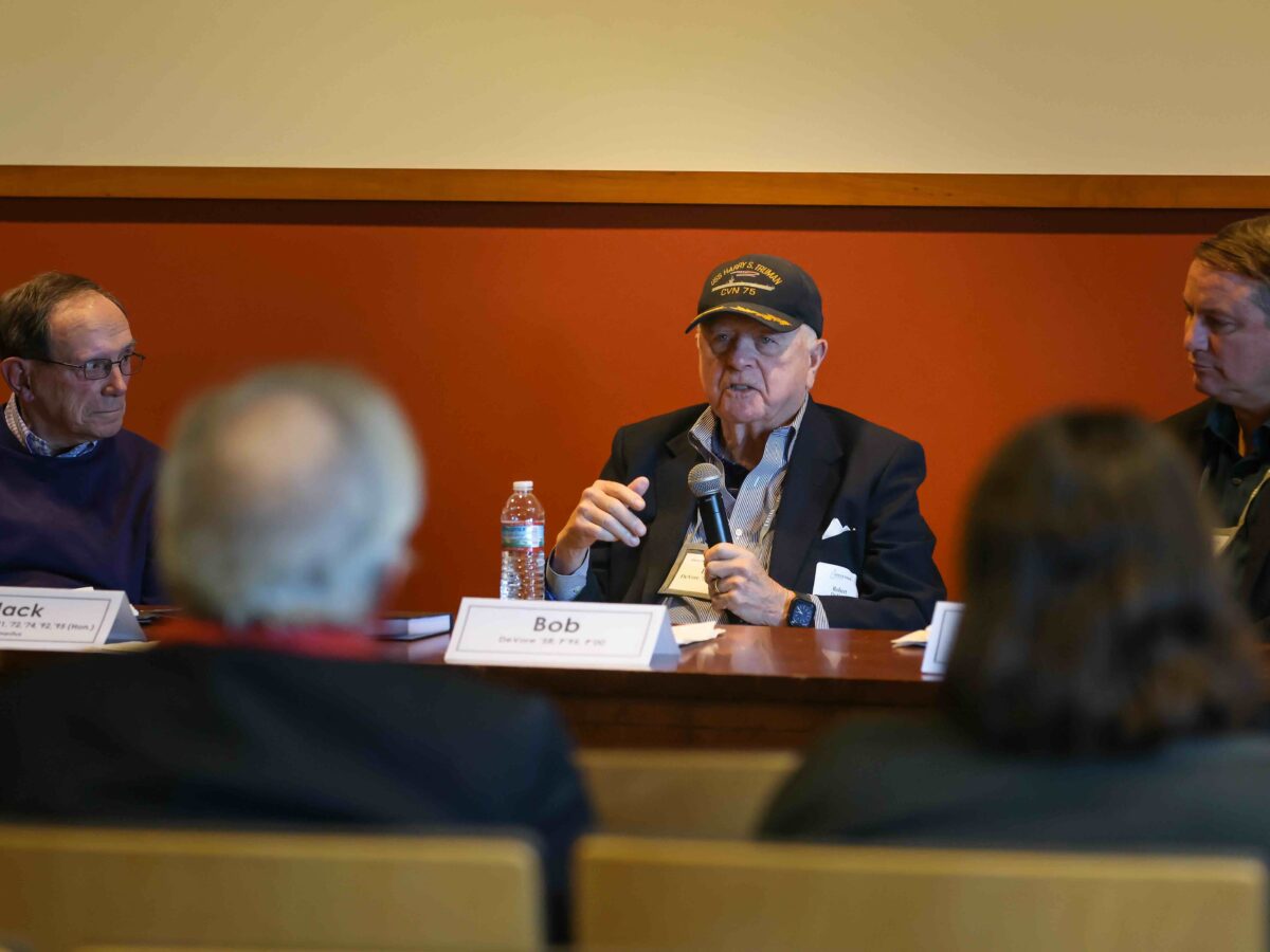 Panel speaker holds microphone.