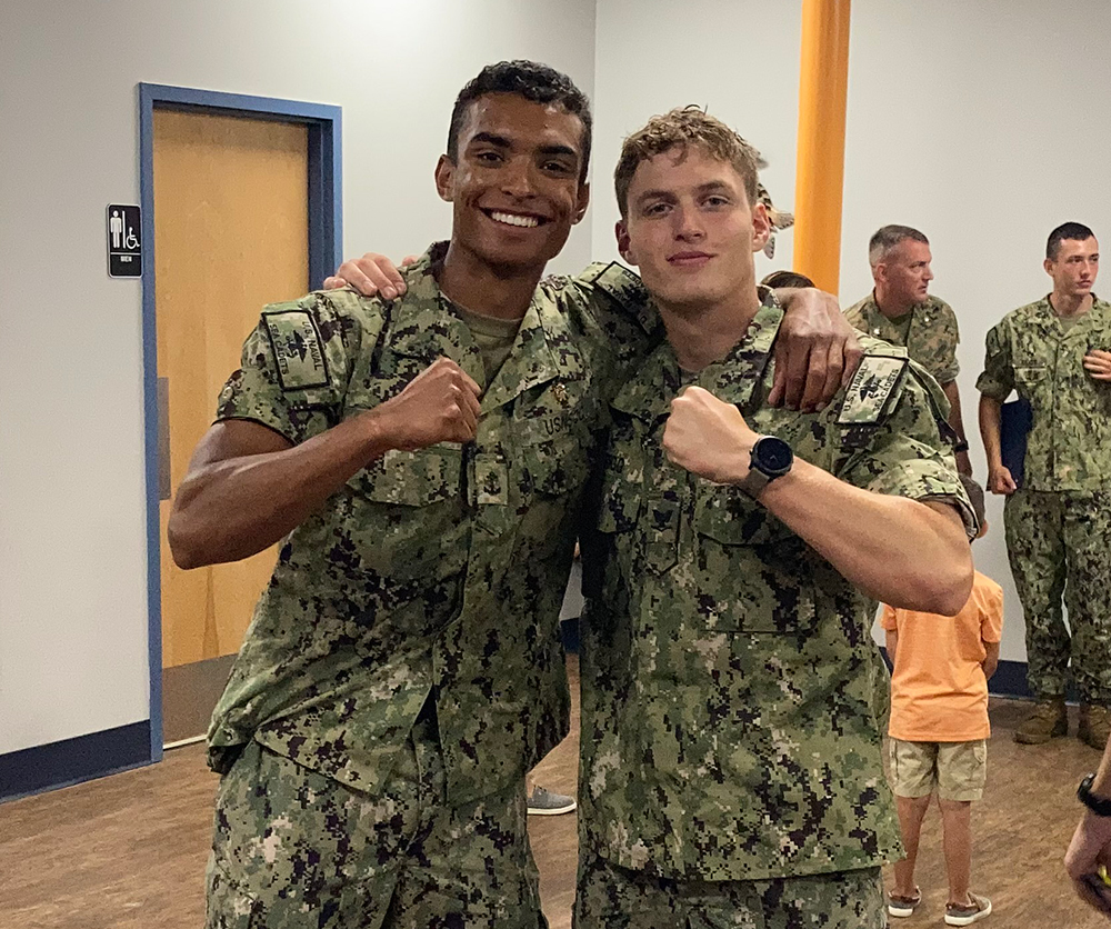 Justin Rigg '23 (right) poses with his classmate after graduating from Naval Special Warfare Orientation Course SEAL training this summer.