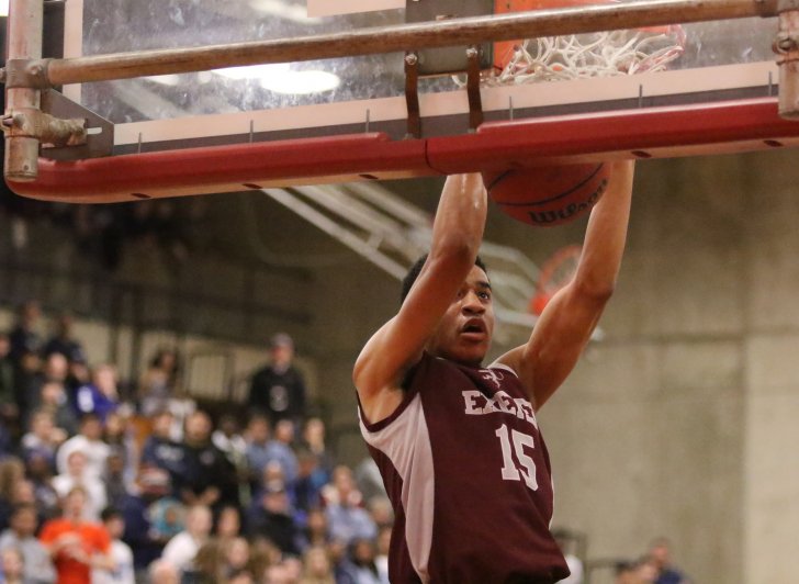 Exeter basketball player dunking a ball