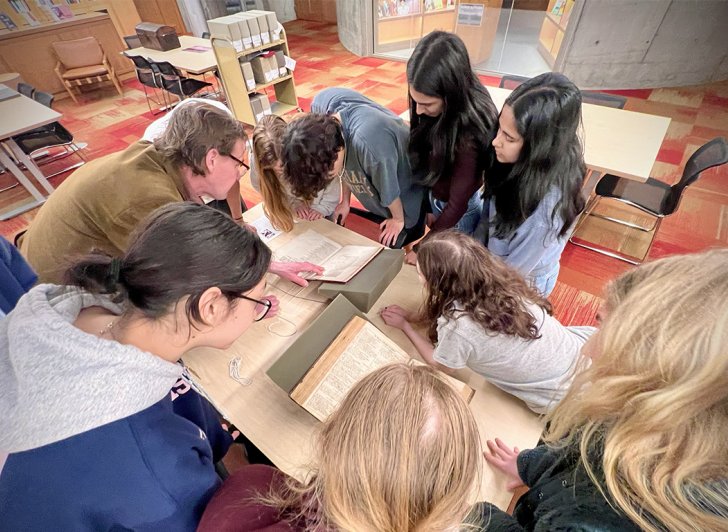 Students looking at the Shakespeare folios