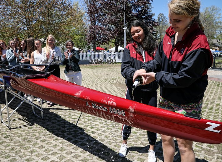 Exeter Varsity crew captains christening the A. Morin shell named for an Exeter alum