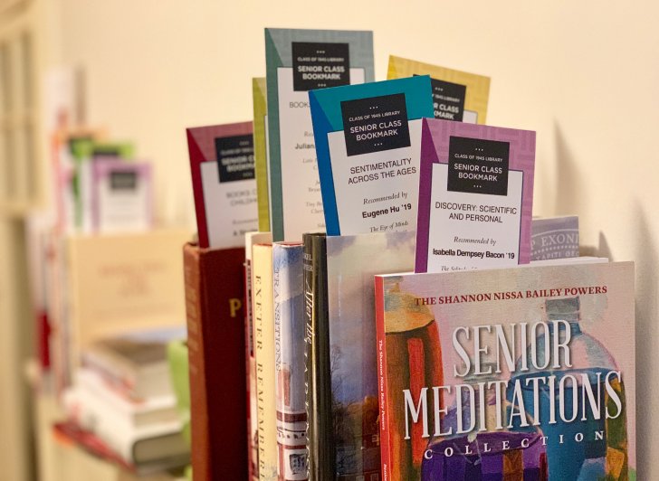 Books sporting senior bookmarks on display at the Phillips Exeter Library.