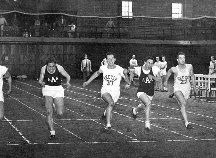 Exeter and Andover sprinters from 1952 competing in an indoor track meet