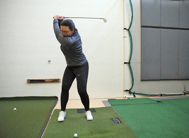 Eunice Kim practicing golf