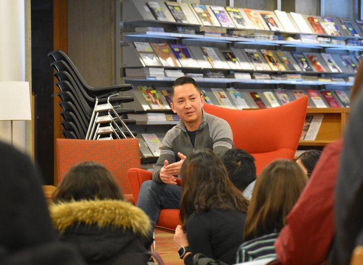 Novelist Viet Thanh Nguyen speaking with students in the library at Exeter