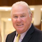 Joe O'Donnell wearing a suit and tie.