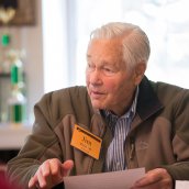 Jim Rose seated at a table during an Exeter reunion.