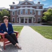 Joanne Lembo sitting outside in front of the Academy Center.