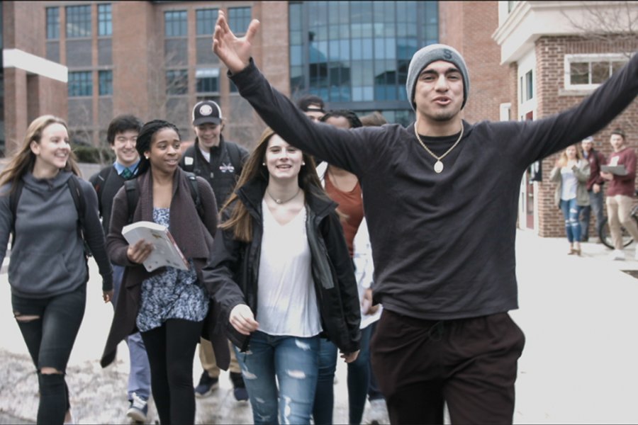 Students walking the paths of Exeter's campus.