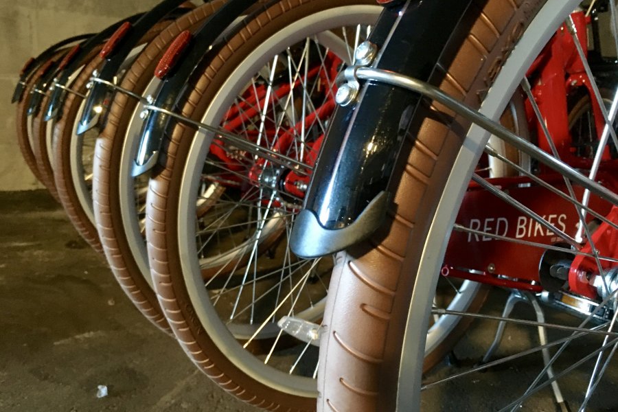 Redbikes lined up in a row.