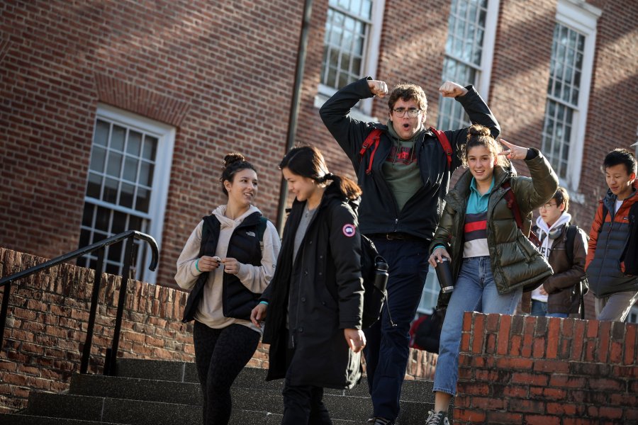 Exeter students walking down the stairs.