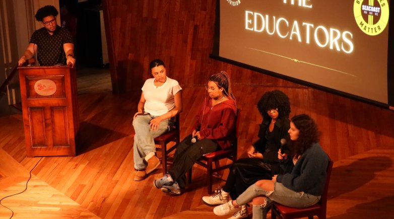 Student panel on stage in the Assembly Hall for "Educate the Educators" event