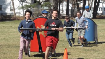 Students simulating a chariot race