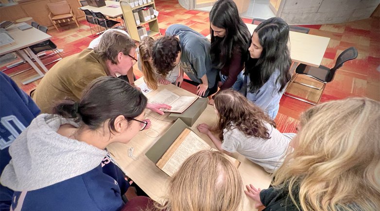 Students looking at the Shakespeare folios