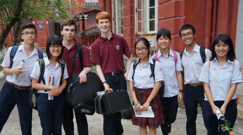 Exeter musicians with a group of students in Vietnam