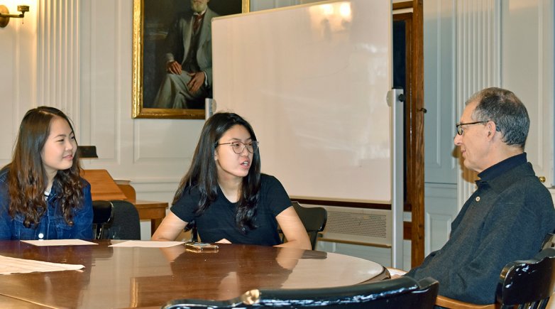 Suan Lee and Angele Yang seated next to Dr. James Romm