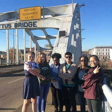 Students in a group in front of the Edmund Pettus Bridge