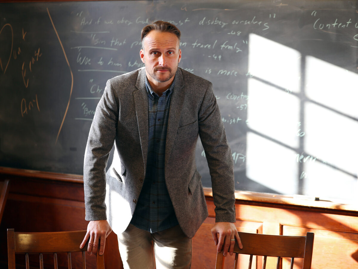 Matt in front of the chalkboard in his Phillips Hall classroom.