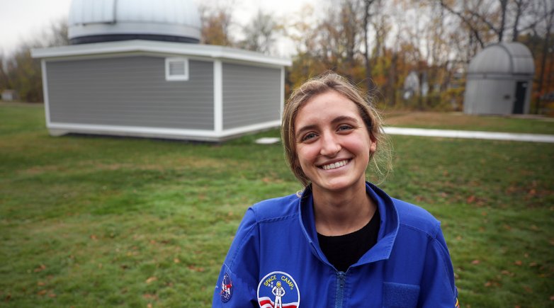 Ursula Wise standing in front of Grainger Observatory at Phillips Exeter Academy