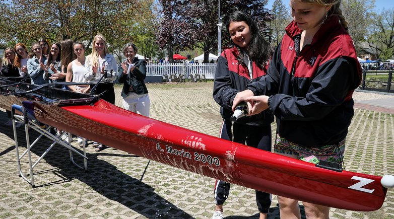 Exeter Varsity crew captains christening the A. Morin shell named for an Exeter alum