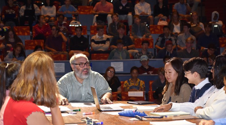 Math Instructor Jeff Ibbotson leads a Harkness discussion in the Goel Center