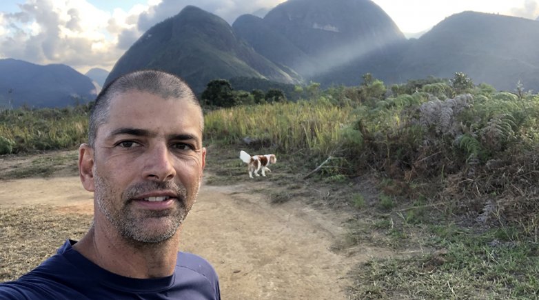 Wolff Klabin standing in front of a mountain range.